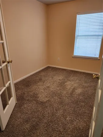 an empty room with a fireplace