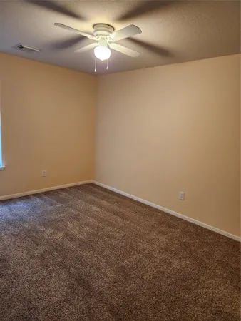 a view of a big room with carpet