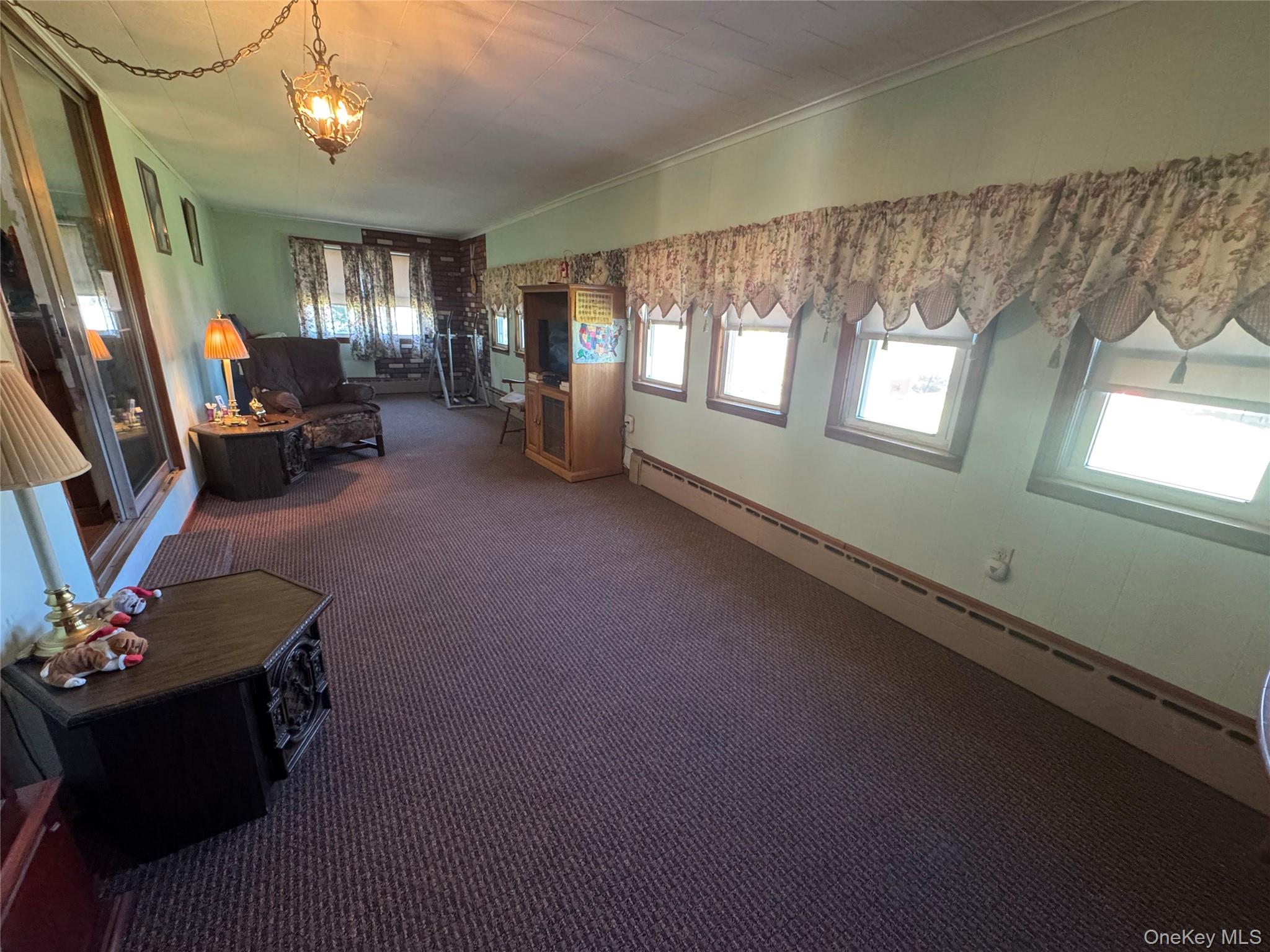 367 Mt Eve Road Goshen, NY 10924 - Photo 23 of 37 a living room with furniture and a flat screen tv