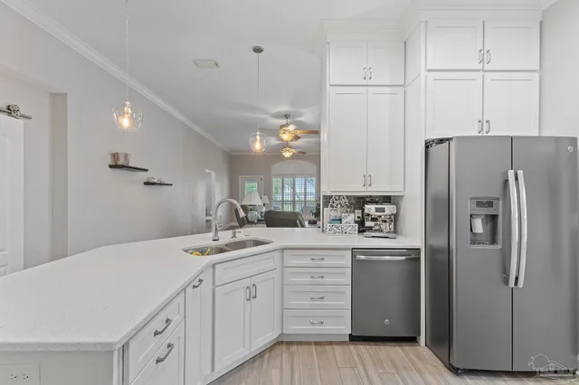 a kitchen with a sink stove and cabinets