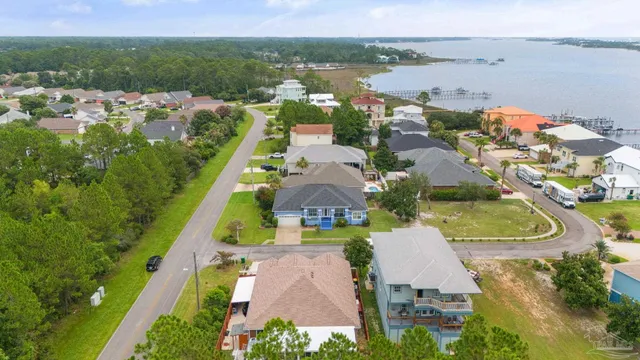 an aerial view of multiple houses with yard