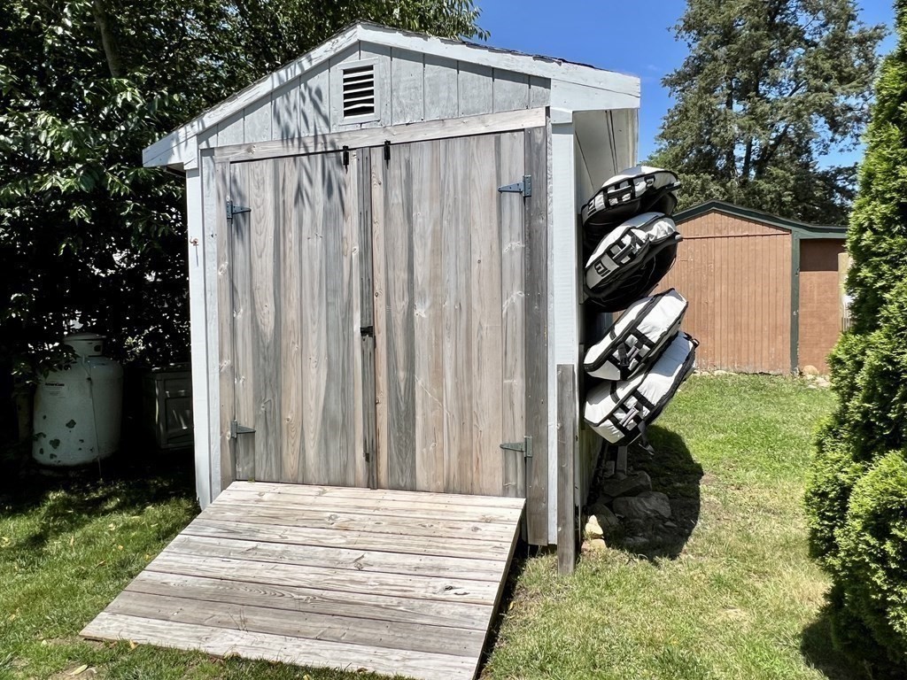 135 Balsam Street Fairhaven, MA 02719 - Photo 28 of 39 a backyard of a house with plants and tree