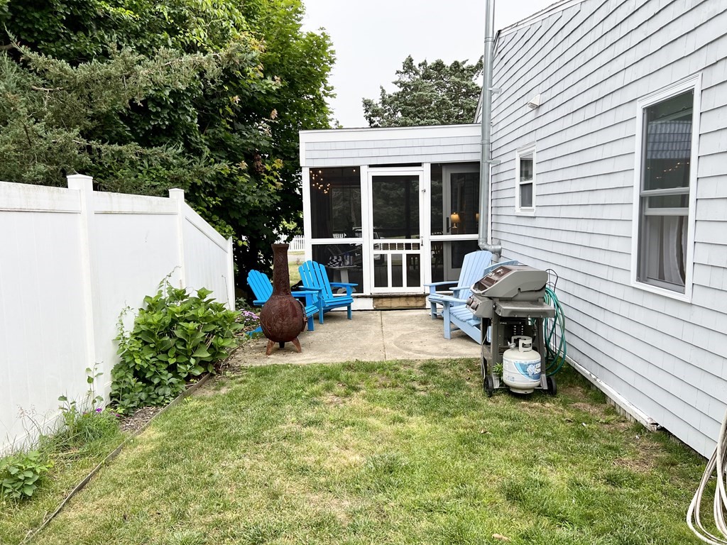 135 Balsam Street Fairhaven, MA 02719 - Photo 33 of 39 a view of a house with backyard sitting area and garden