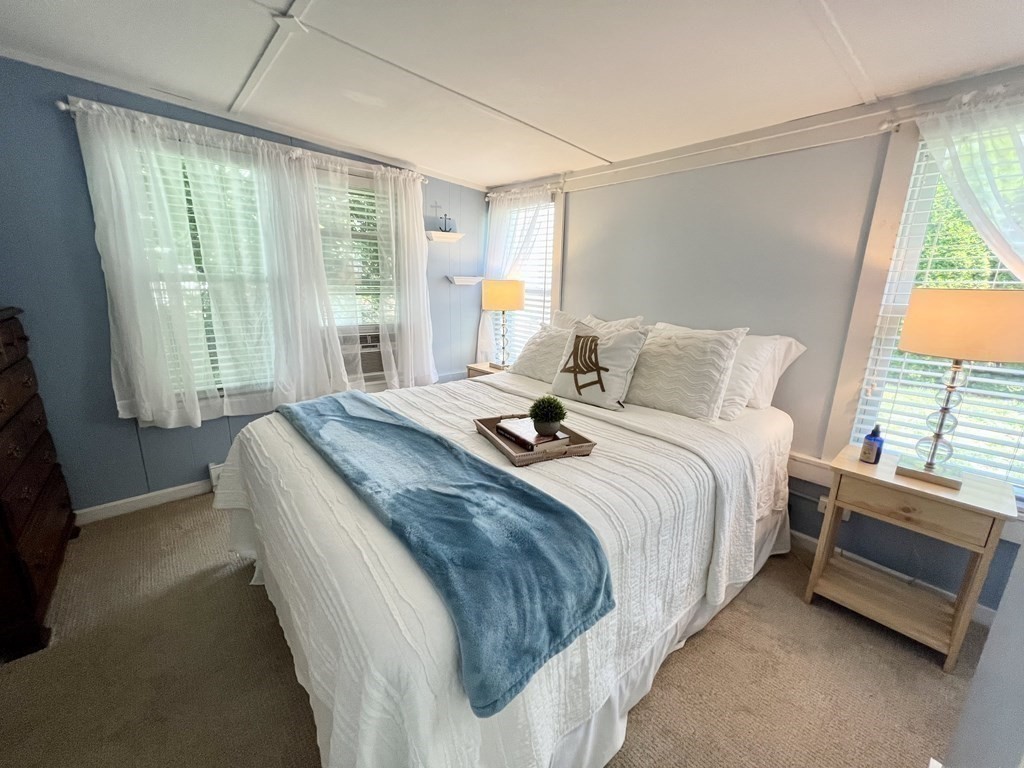 135 Balsam Street Fairhaven, MA 02719 - Photo 10 of 39 a bedroom with a bed and large windows