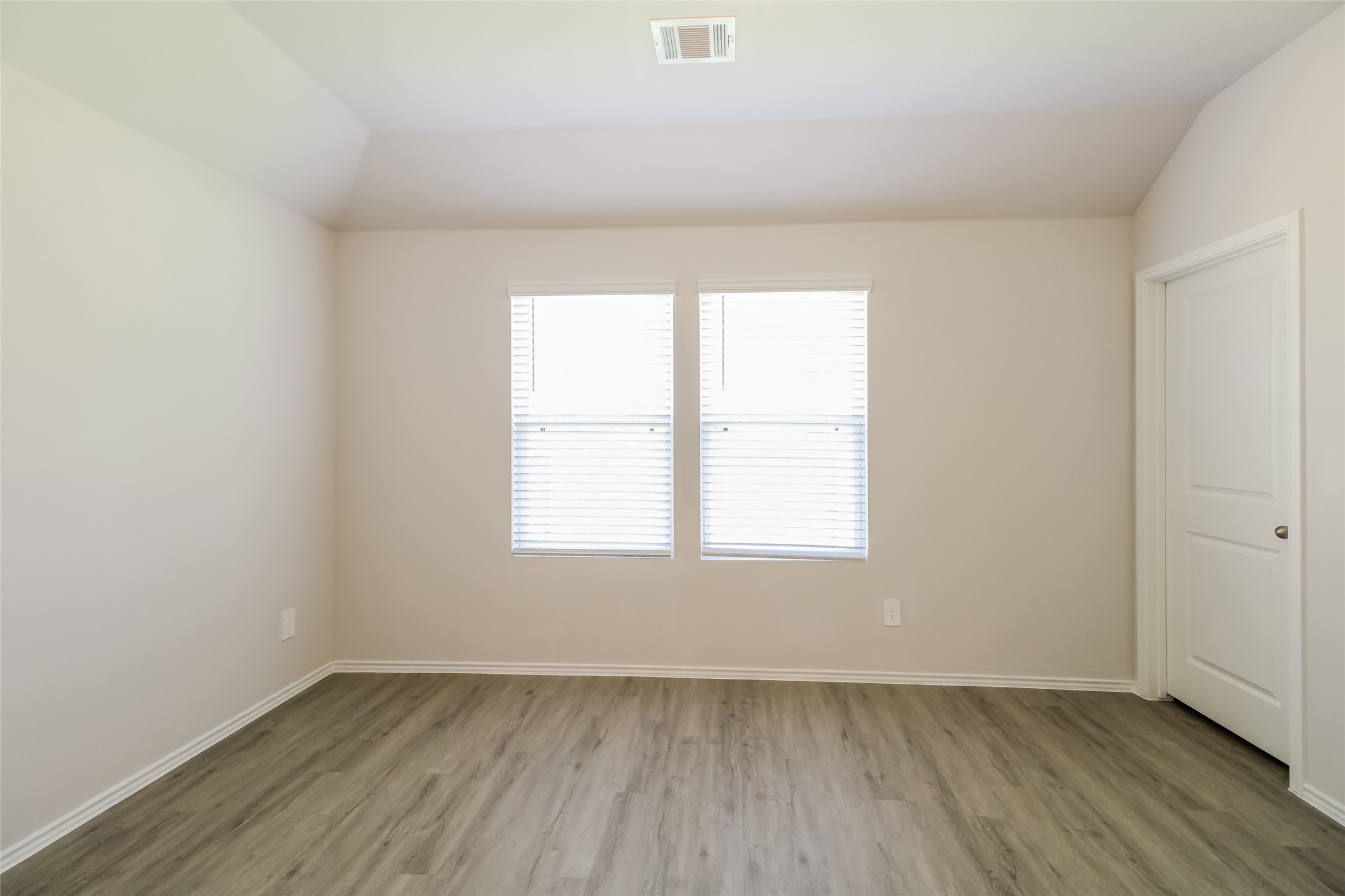 2536 Shad Drive Conroe, TX 77384 - Photo 8 of 17 an empty room with wooden floor and window