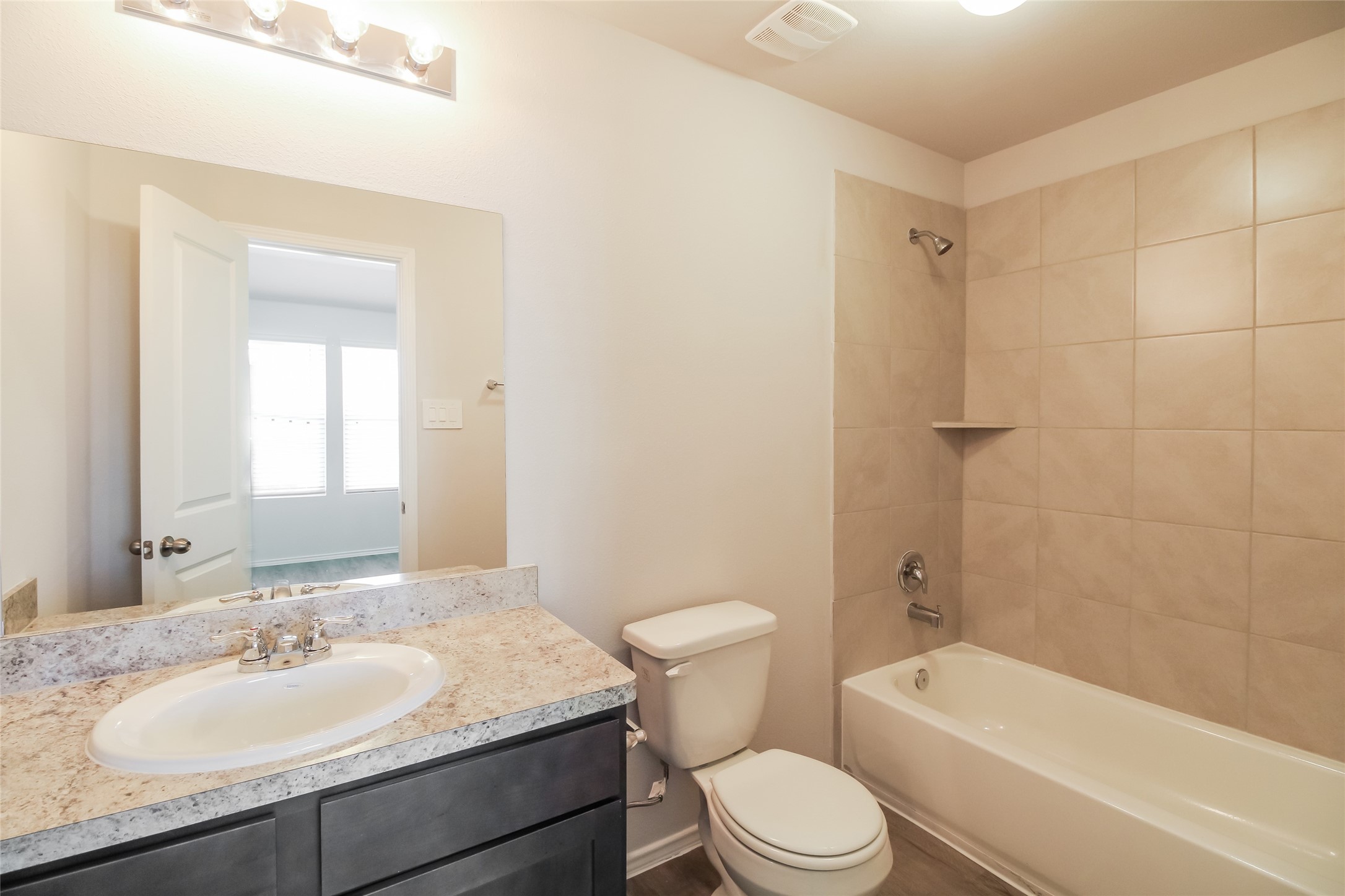 2536 Shad Drive Conroe, TX 77384 - Photo 9 of 17 a bathroom with a granite countertop sink toilet tub and shower