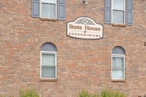 a view of a door with brick wall