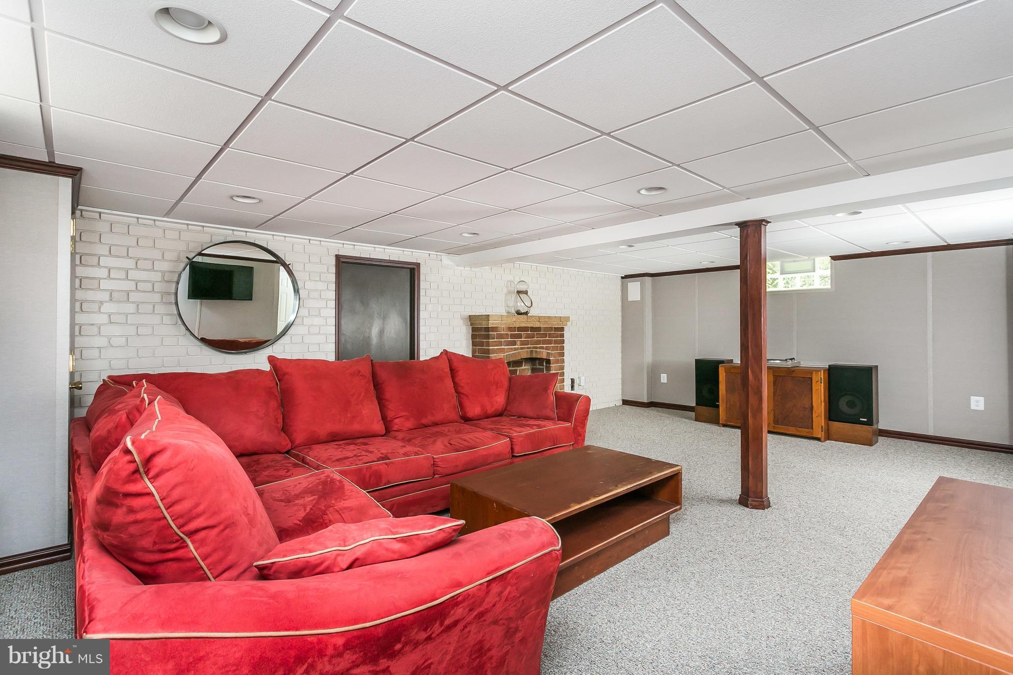 1814 Clearwood Road Baltimore, MD 21234 - Photo 22 of 30 a living room with furniture and a flat screen tv