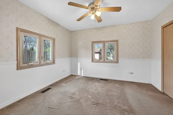 a view of an empty room with a window