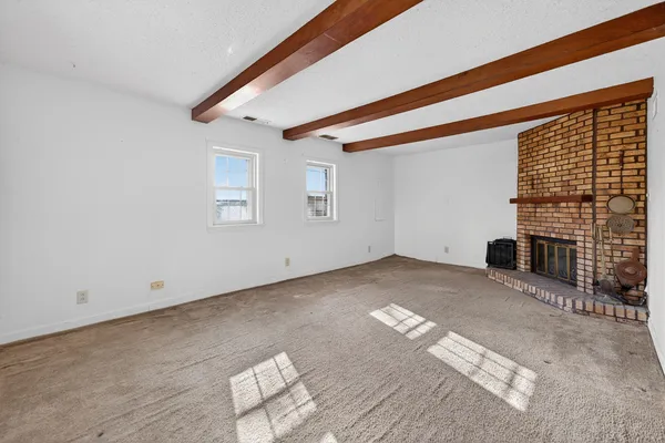 a view of empty room with windows