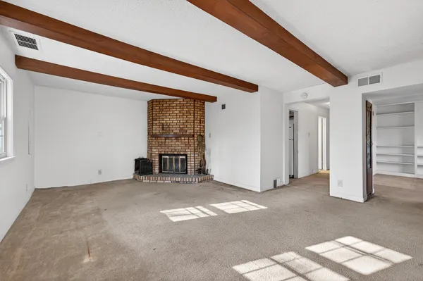 a view of empty room with windows