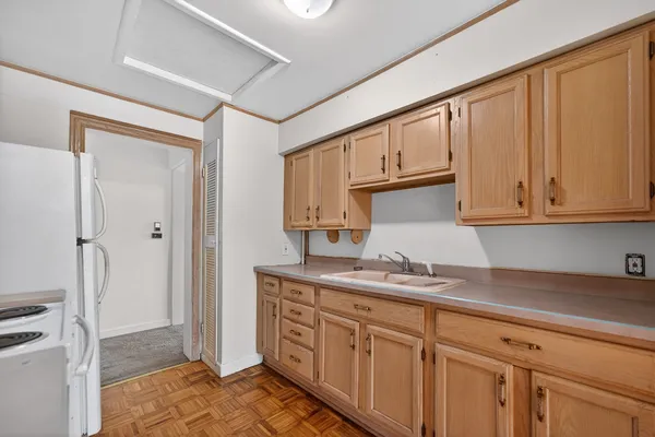 a kitchen with stainless steel appliances granite countertop a sink and a cabinets