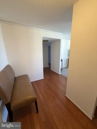 a view of livingroom with furniture and wooden floor
