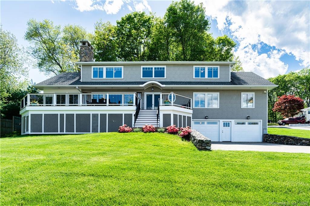 Gorgeous home sits majestically on beautiful lot with lake views.