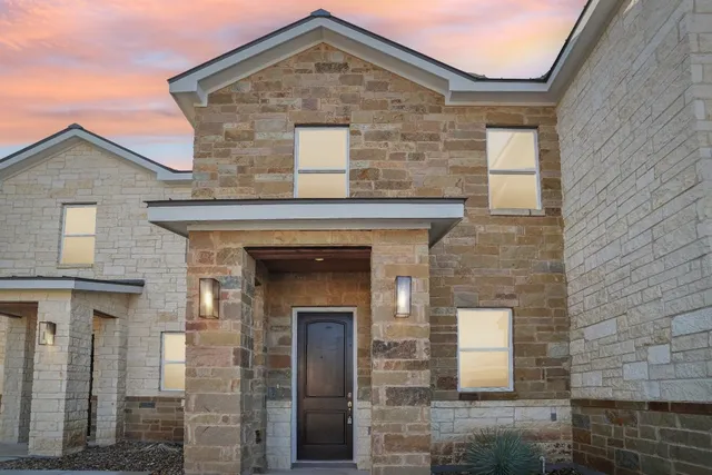 a front view of a stone house