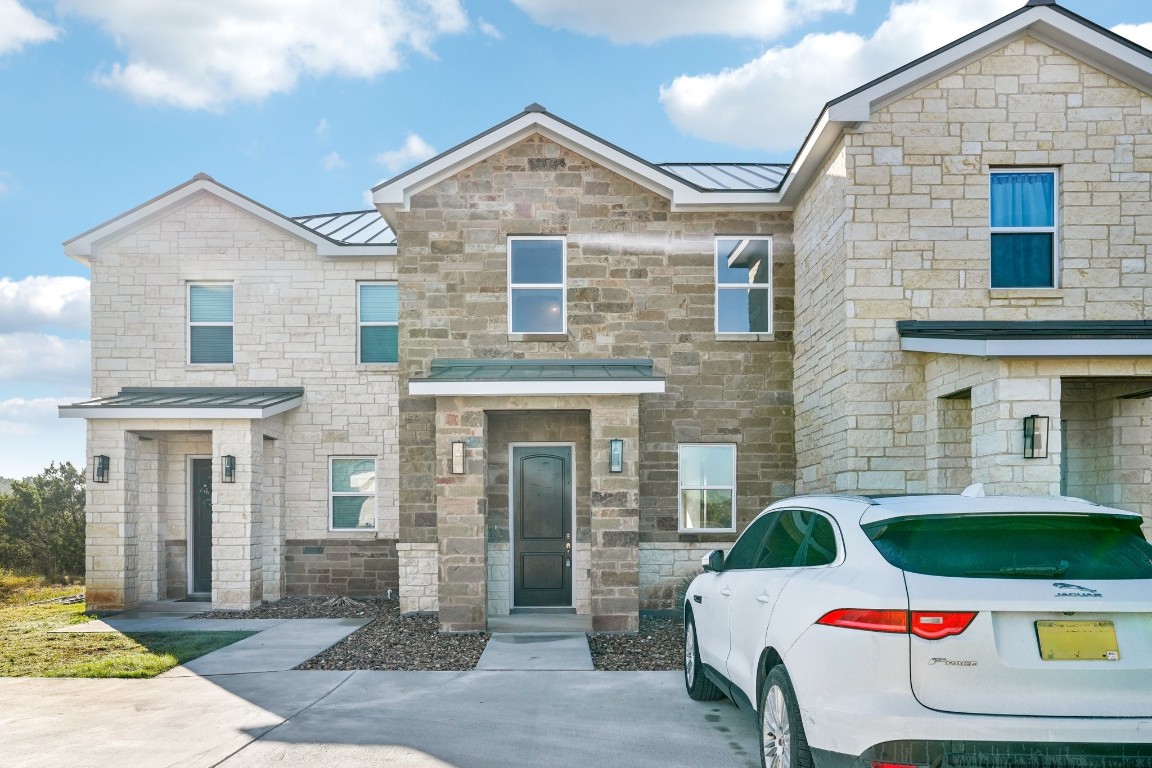 289 Star Grass Spring Branch, TX 78070 - Photo 3 of 39 a front view of a house with a yard and garage