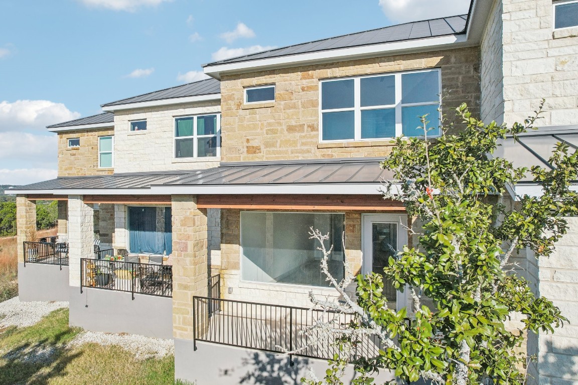 289 Star Grass Spring Branch, TX 78070 - Photo 39 of 39 a front view of a house with a glass windows and potted plants