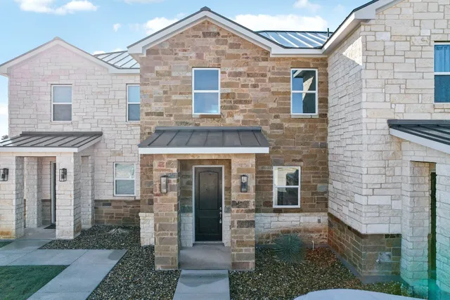 a front view of a house with yard
