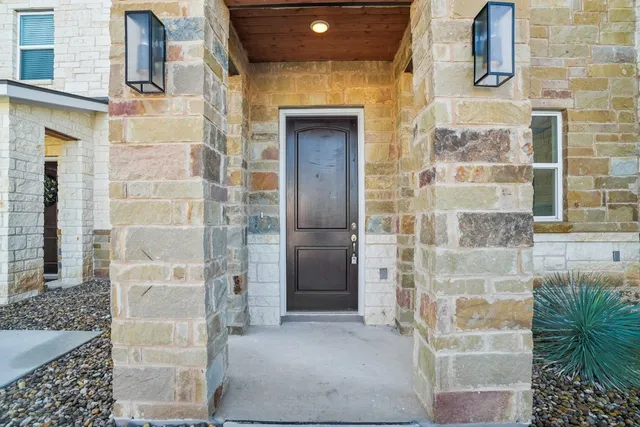 a bathroom with a shower and a mirror