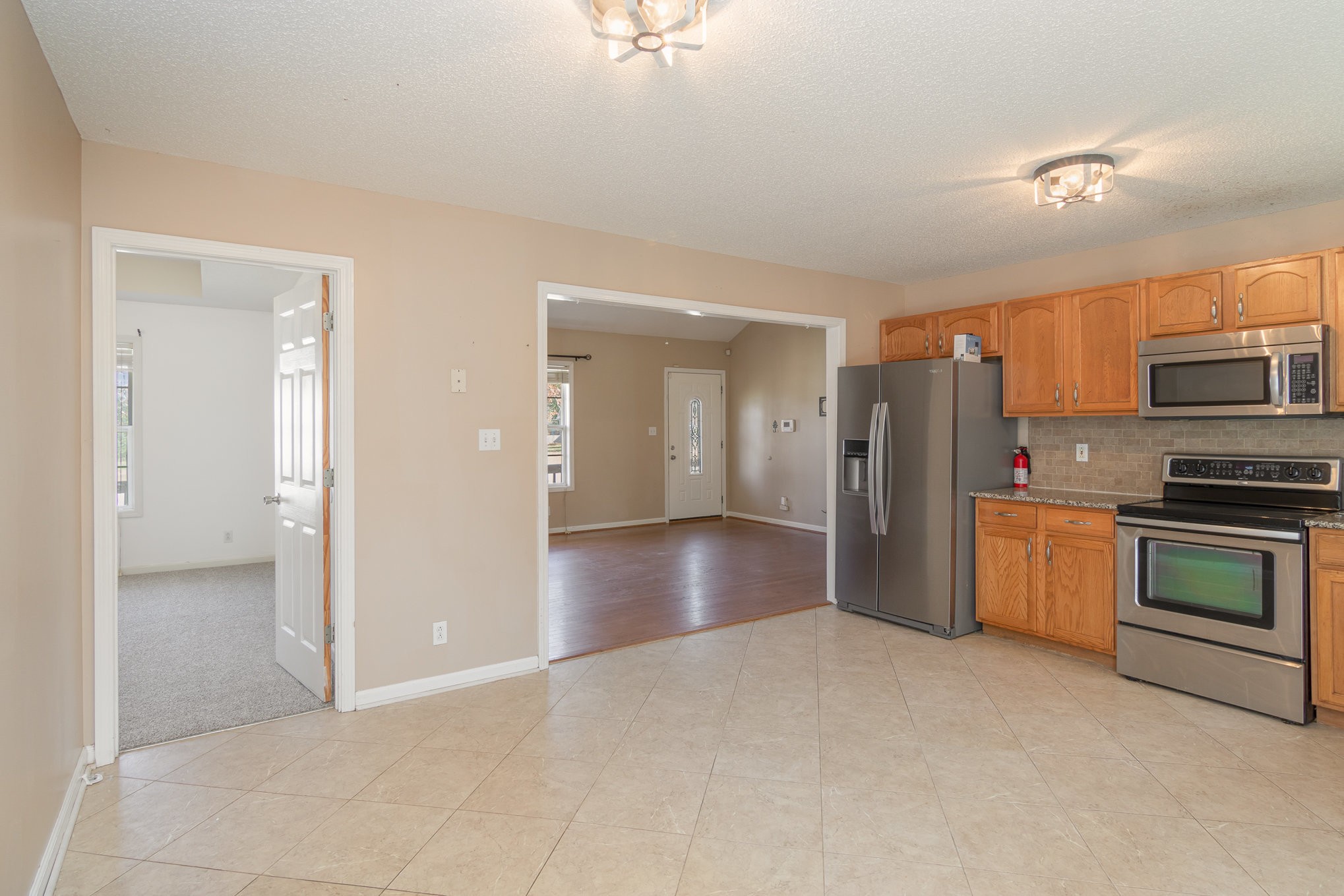 3289 Backridge Road Woodlawn, TN 37191 - Photo 13 of 30 a view of a kitchen with a refrigerator a microwave and a sink