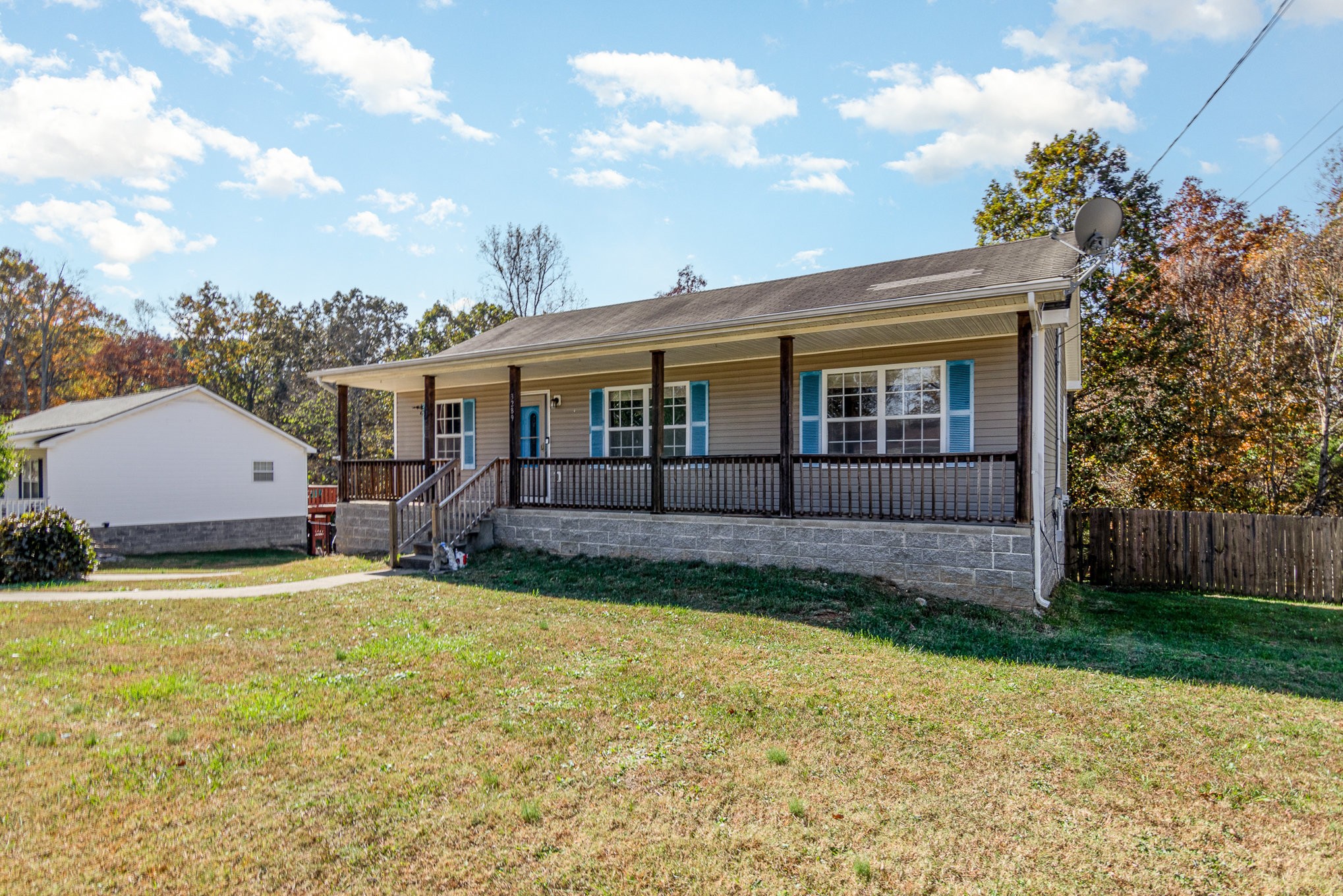 3289 Backridge Road Woodlawn, TN 37191 - Photo 4 of 30 a view of a house with a garden and yard