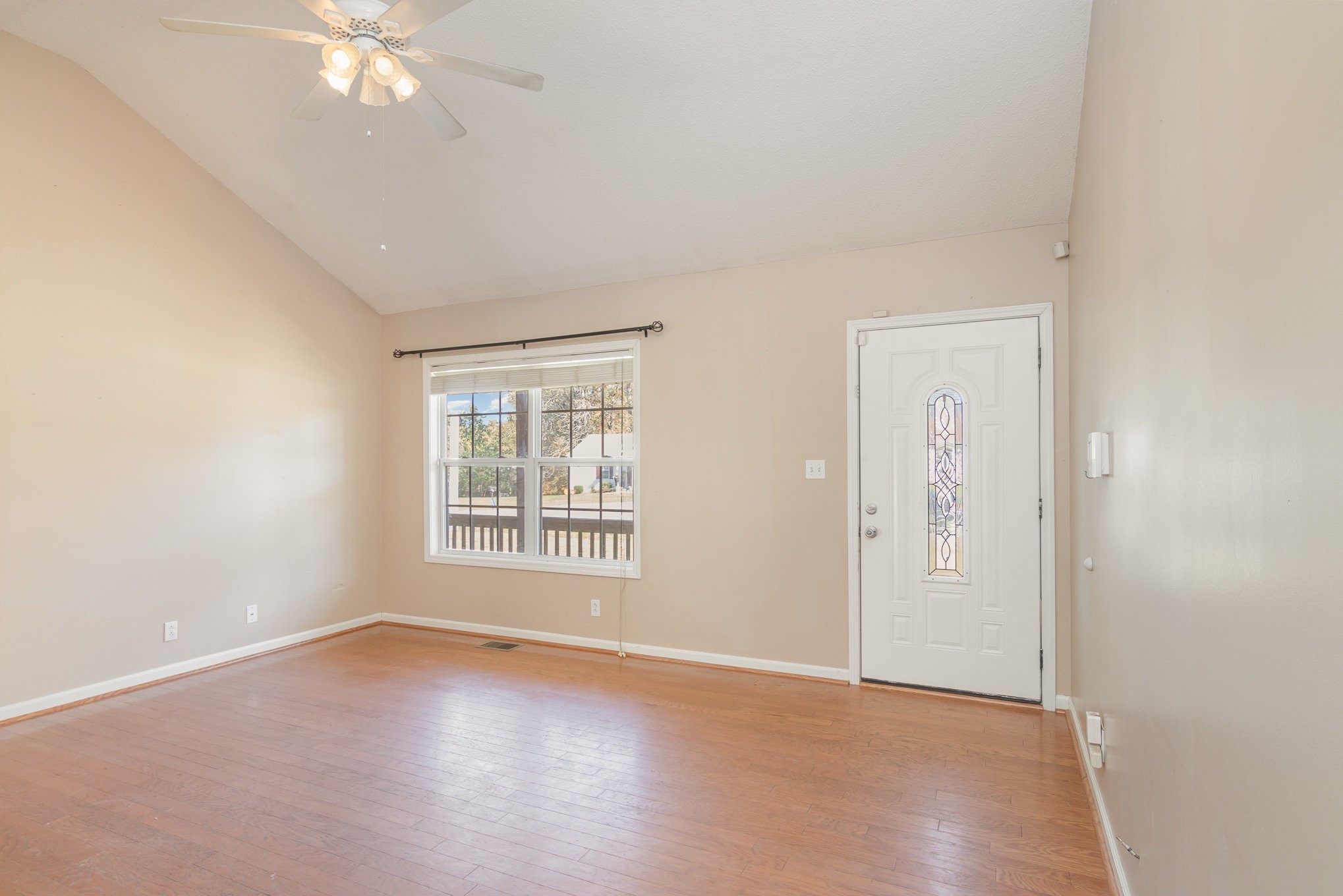 3289 Backridge Road Woodlawn, TN 37191 - Photo 6 of 30 an empty room with windows and fan