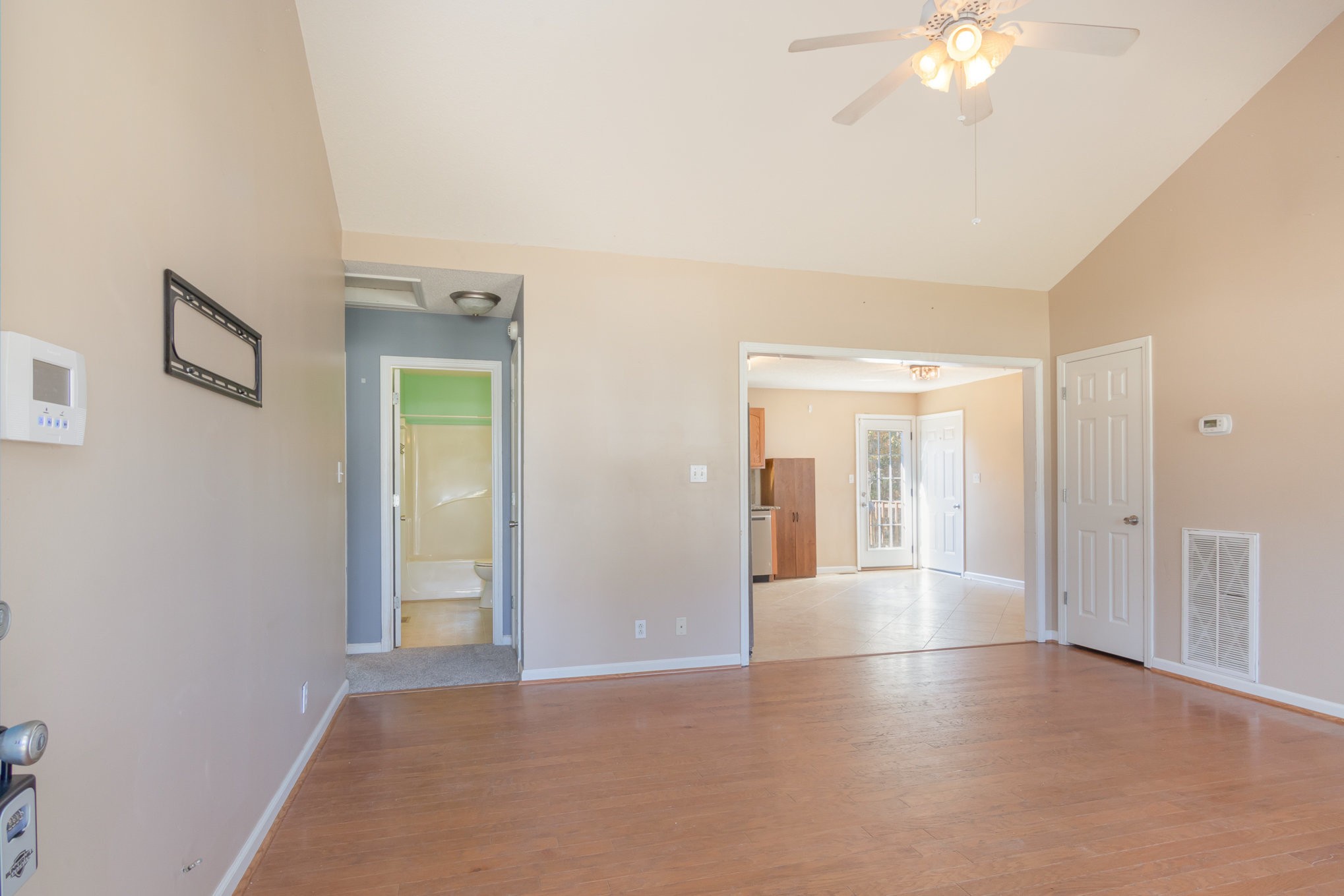 3289 Backridge Road Woodlawn, TN 37191 - Photo 8 of 30 an empty room with chandelier fan and windows
