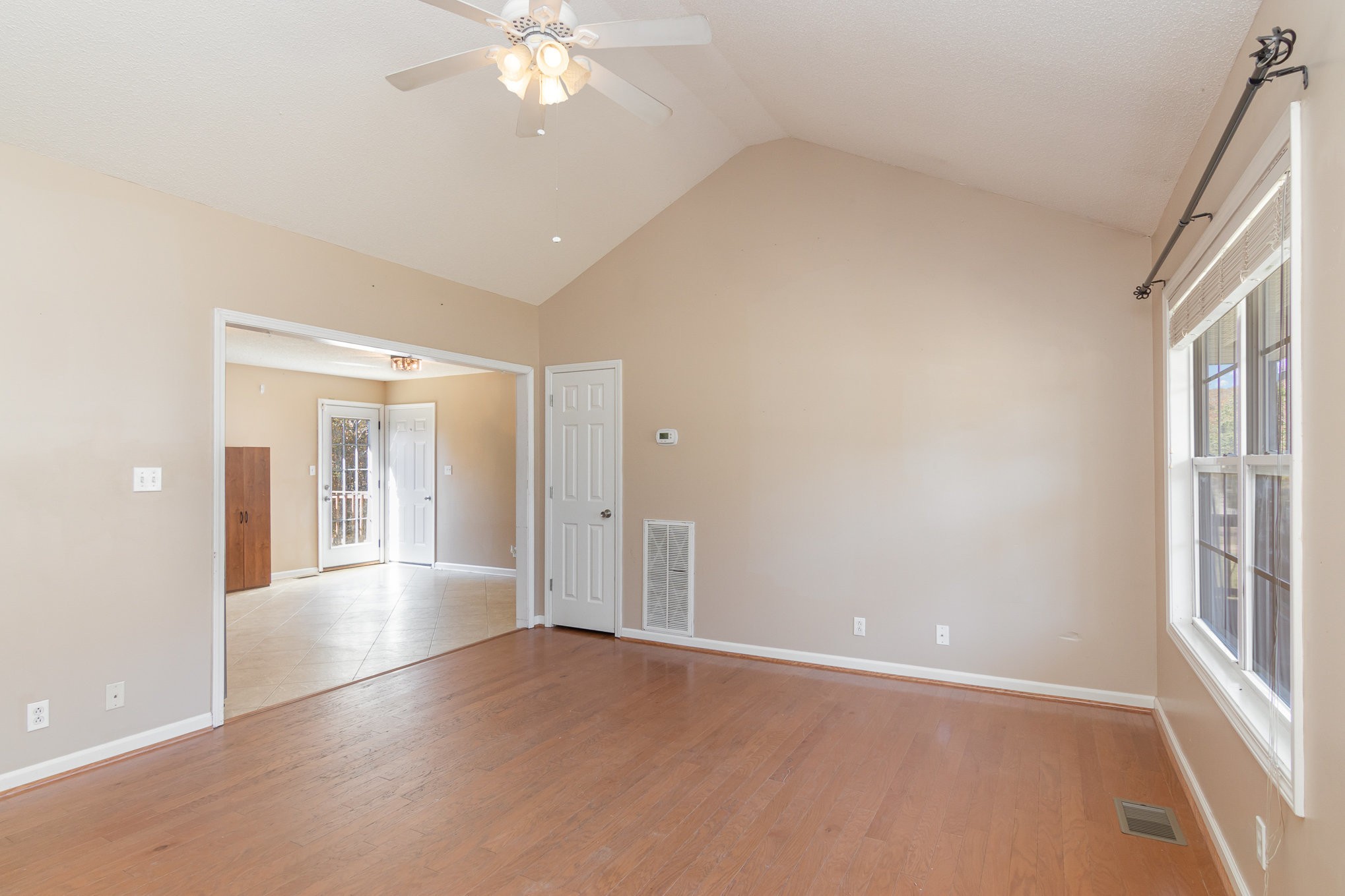 3289 Backridge Road Woodlawn, TN 37191 - Photo 9 of 30 wooden floor in an empty room with a window