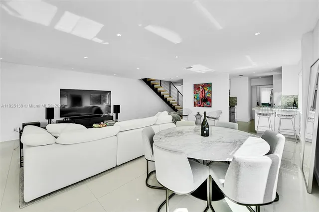 a open kitchen with granite countertop a sink and a stove