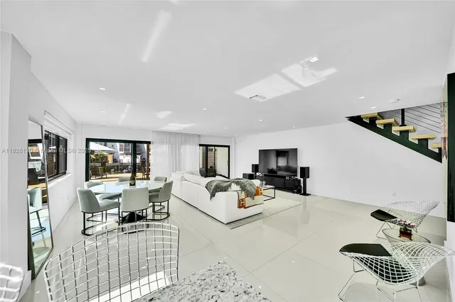 a kitchen with a sink cabinets and appliances