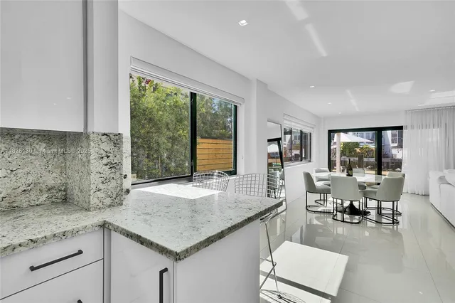 a bedroom with a bed and a table