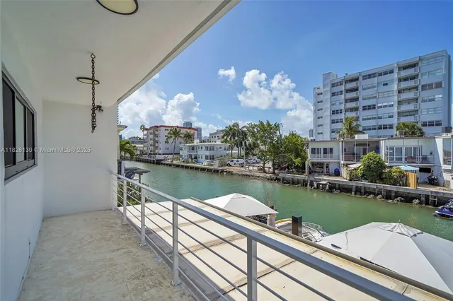 an aerial view of a house with a ocean view