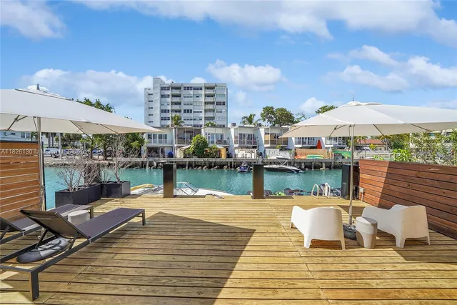 a view of a brick house with a large windows