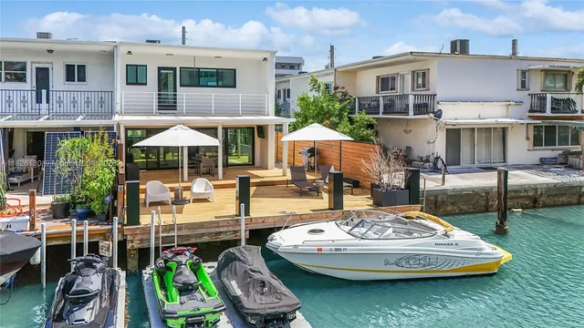 a view of a backyard with a tree