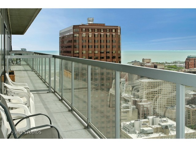235 West Van Buren Street, Unit 4606 Chicago, IL 60607 - Photo 14 of 22 a view of balcony with wooden floor