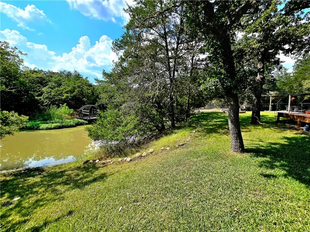 a view of a lake with a yard