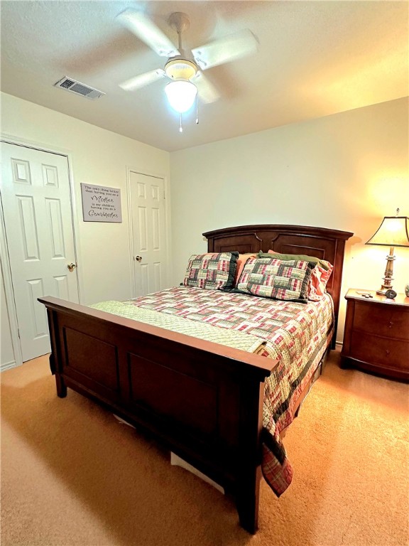 219 Ripple Creek Lane Somerville, TX 77879 - Photo 24 of 40 a bed sitting in a bedroom next to a window