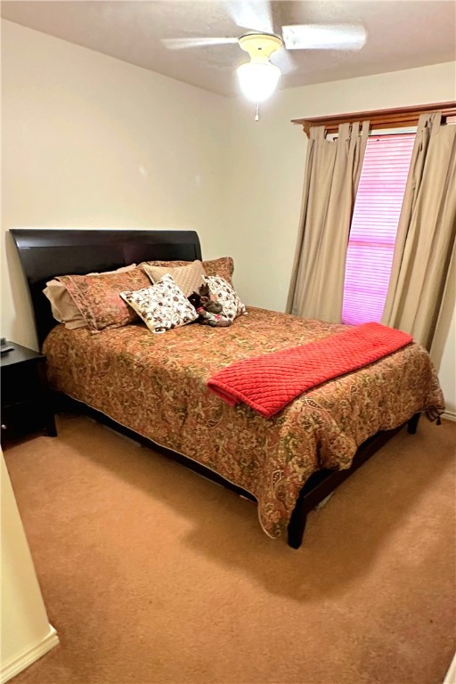 219 Ripple Creek Lane Somerville, TX 77879 - Photo 26 of 40 a bedroom with a bed and lamp with window