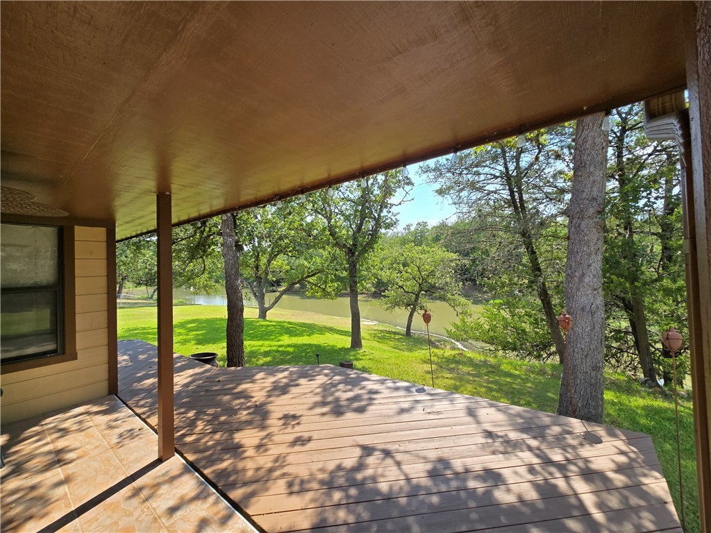 219 Ripple Creek Lane Somerville, TX 77879 - Photo 9 of 40 a view of backyard with large trees and plants