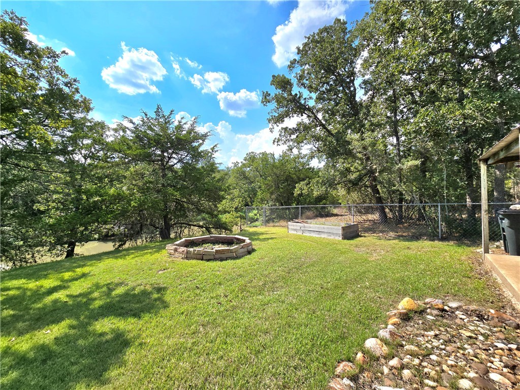 219 Ripple Creek Lane Somerville, TX 77879 - Photo 10 of 40 a view of a backyard with swimming pool