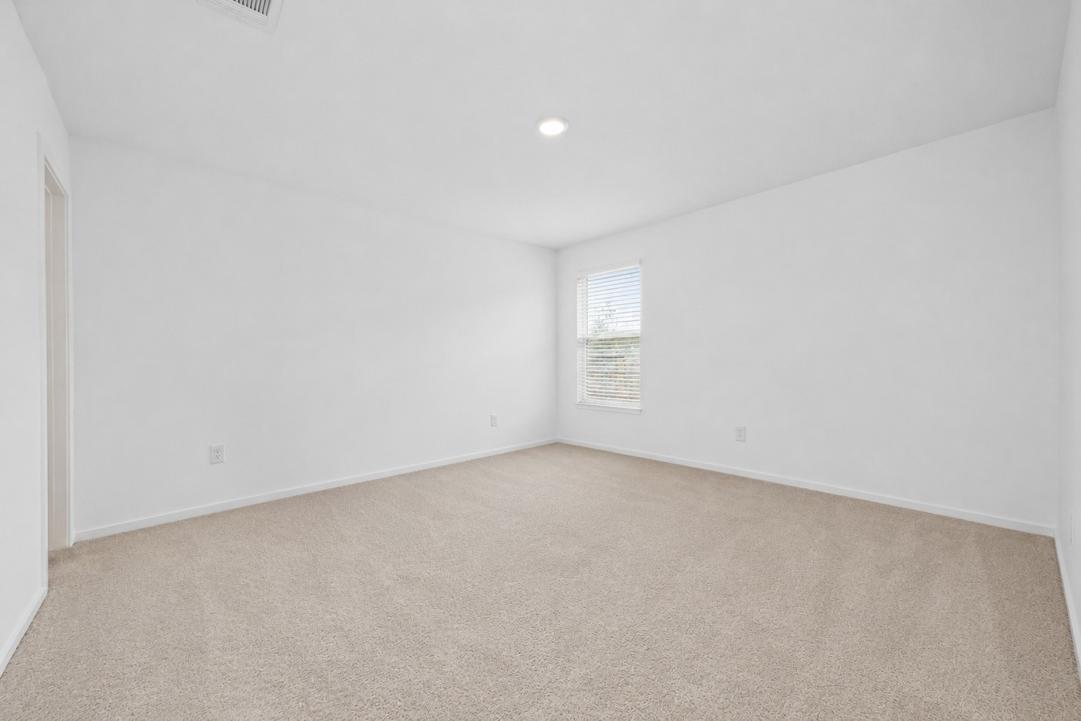 10720 Ellerston Road Cleveland, TX 77327 - Photo 15 of 27 a view of an empty room and a window