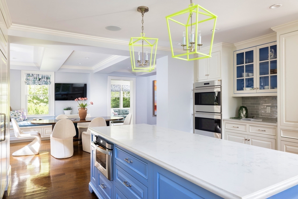1004 Centre Street Newton, MA 02459 - Photo 12 of 34 a kitchen with stainless steel appliances a stove a refrigerator and cabinets