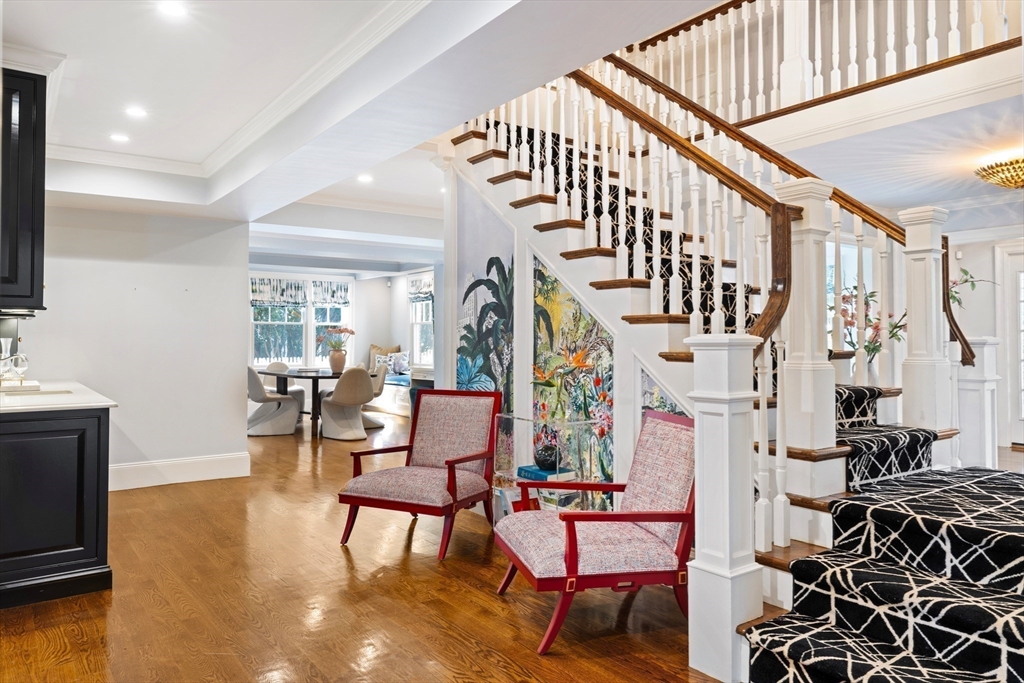 1004 Centre Street Newton, MA 02459 - Photo 16 of 34 a living room with furniture and a chandelier