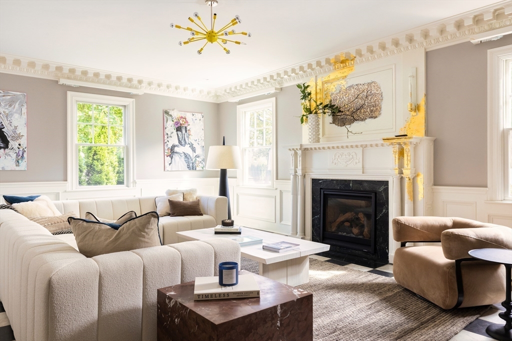 1004 Centre Street Newton, MA 02459 - Photo 2 of 34 a living room with furniture a fireplace and a large window