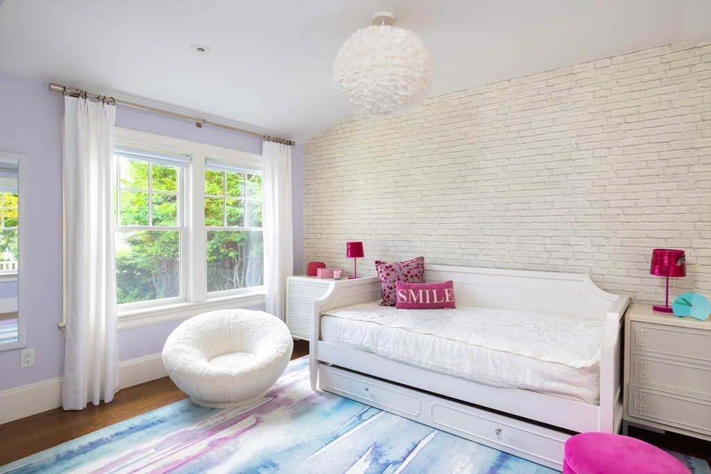 1004 Centre Street Newton, MA 02459 - Photo 22 of 34 a bedroom with furniture and a large window