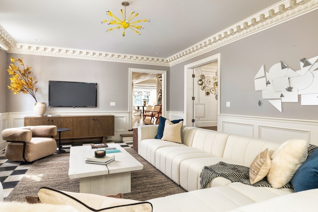 1004 Centre Street Newton, MA 02459 - Photo 3 of 34 a living room with furniture and a chandelier