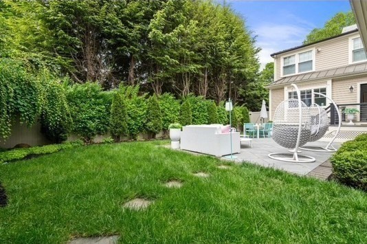 1004 Centre Street Newton, MA 02459 - Photo 31 of 34 a view of a chair and table in backyard of house