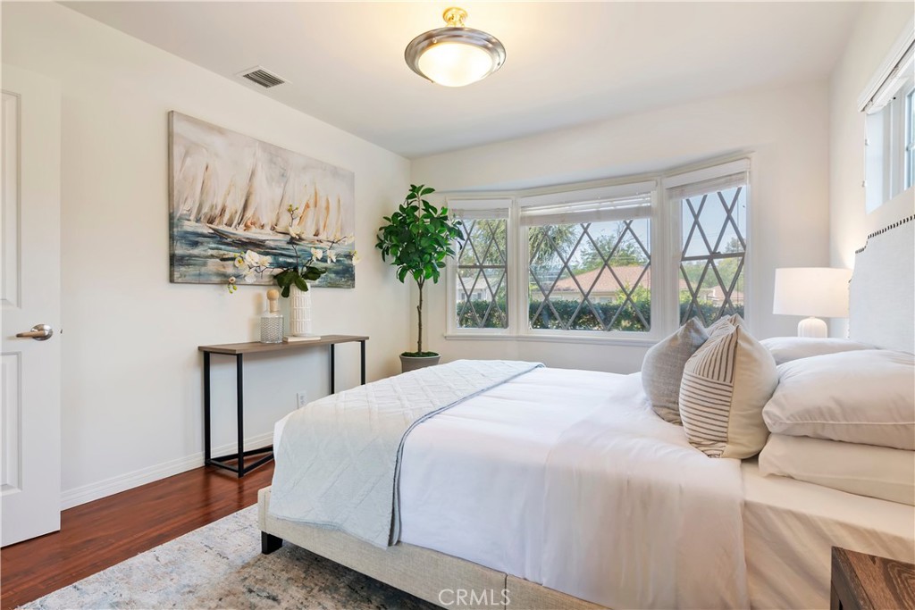 16828 Margate Street Encino, CA 91436 - Photo 10 of 21 a bedroom with a large bed and a window