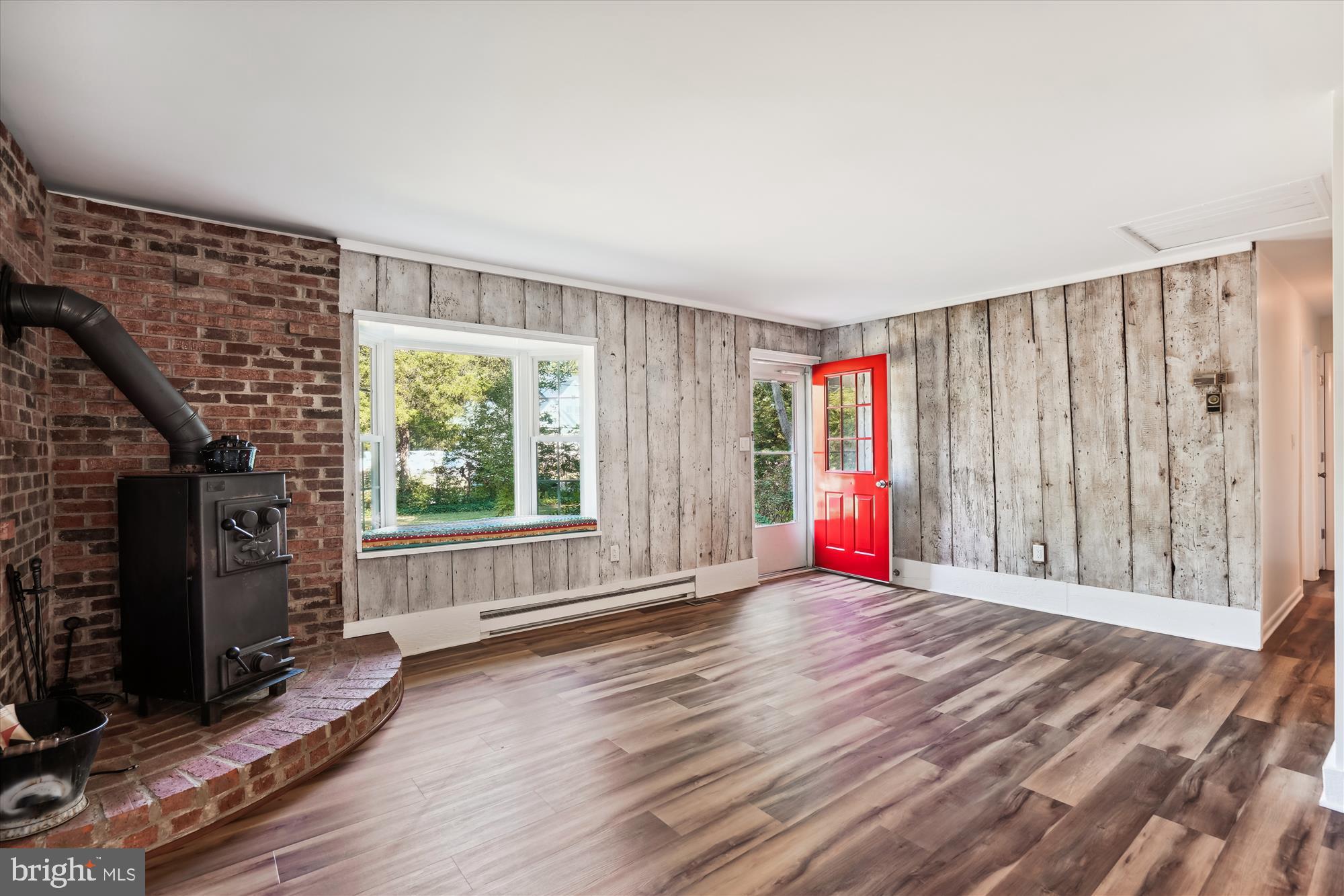 7305 Station Road Newcomb, MD 21653 - Photo 5 of 21 Spacious living room with wood stove