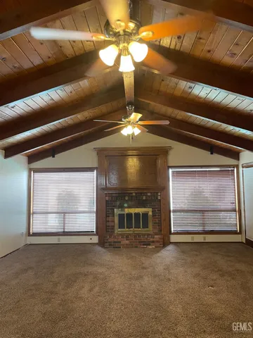 a living room with fireplace furniture and a fireplace